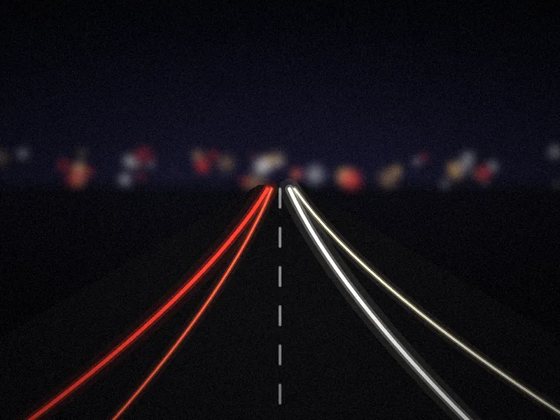 Carretera de noche con estelas de luces